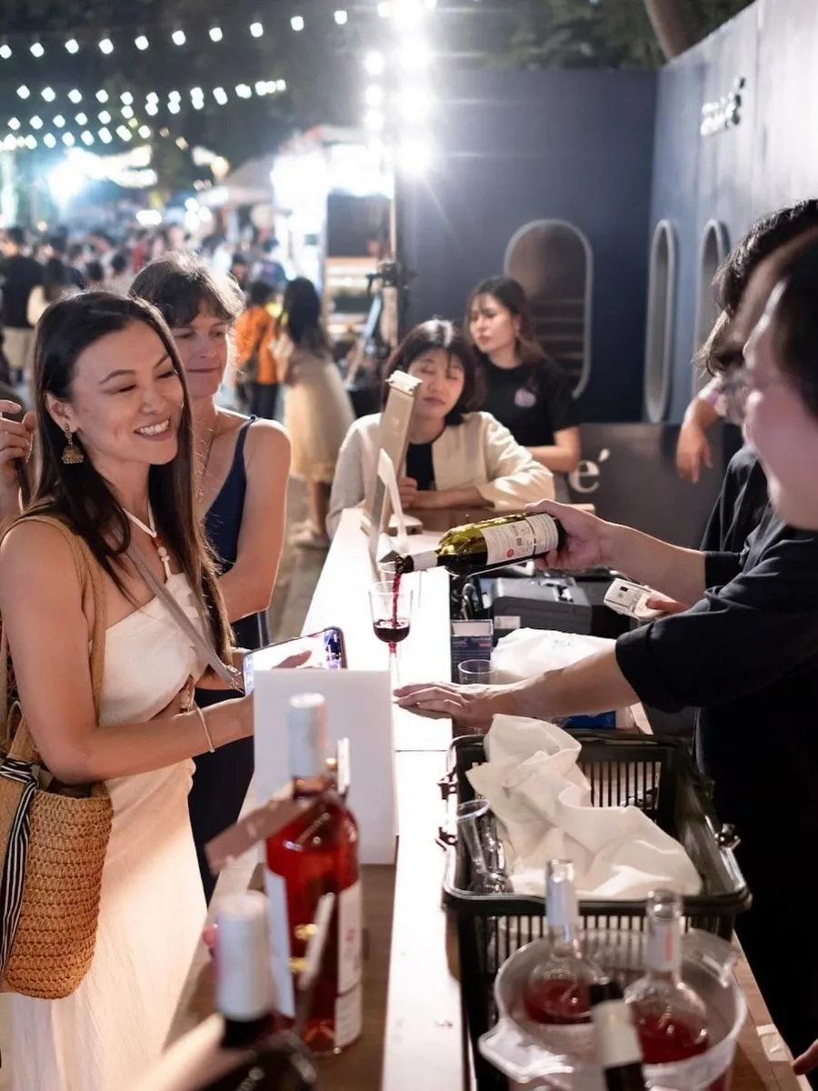 Puring a Glass Of Wine to ladies
